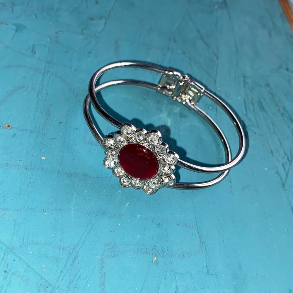 Unique clamper bracelet flower design silver color rhinestones red center